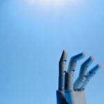 Robot Fingers on Blue Background